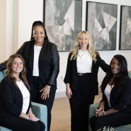 Prose LaGrange Four women in a room smiling at the camera