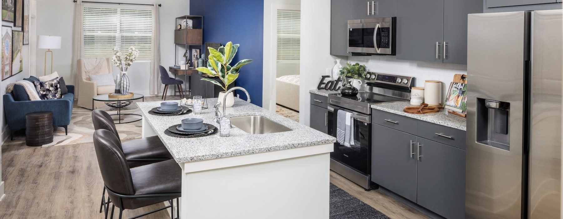 Model kitchen at Prose LaGrange apartments for rent in LaGrange, GA, featuring stainless steel appliances.