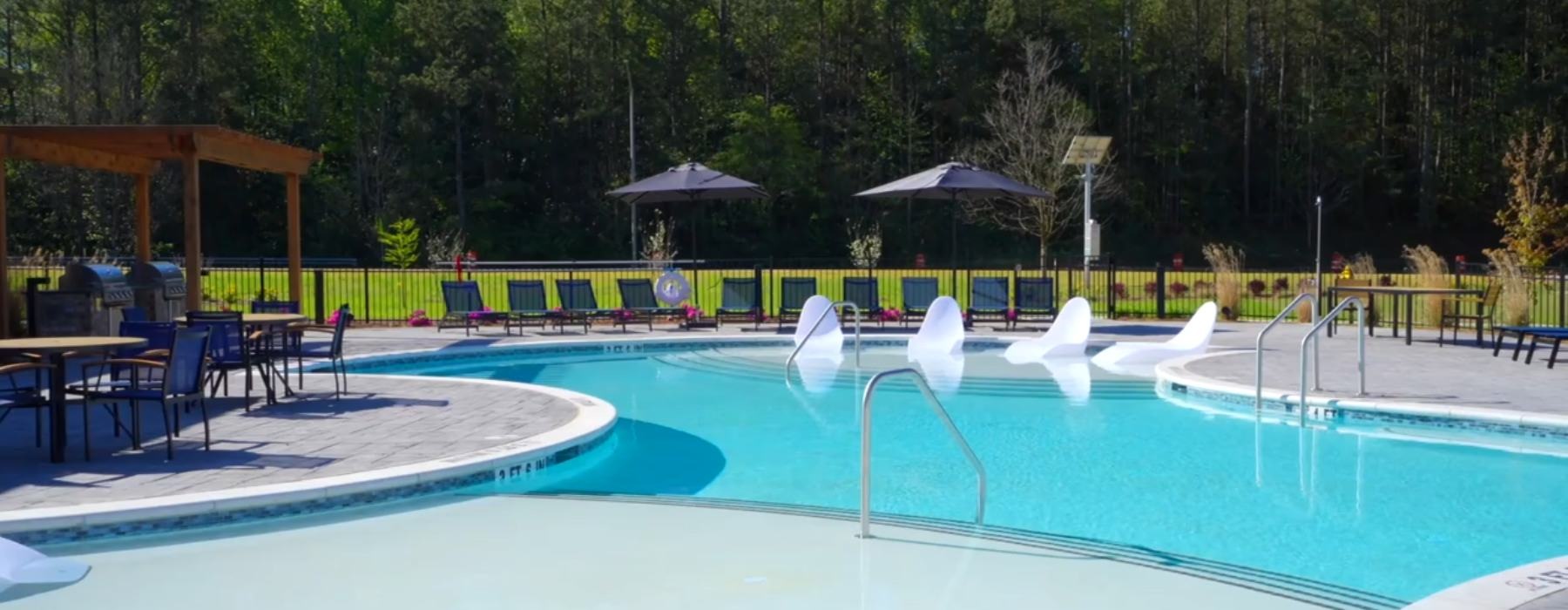 pool with lounge chairs